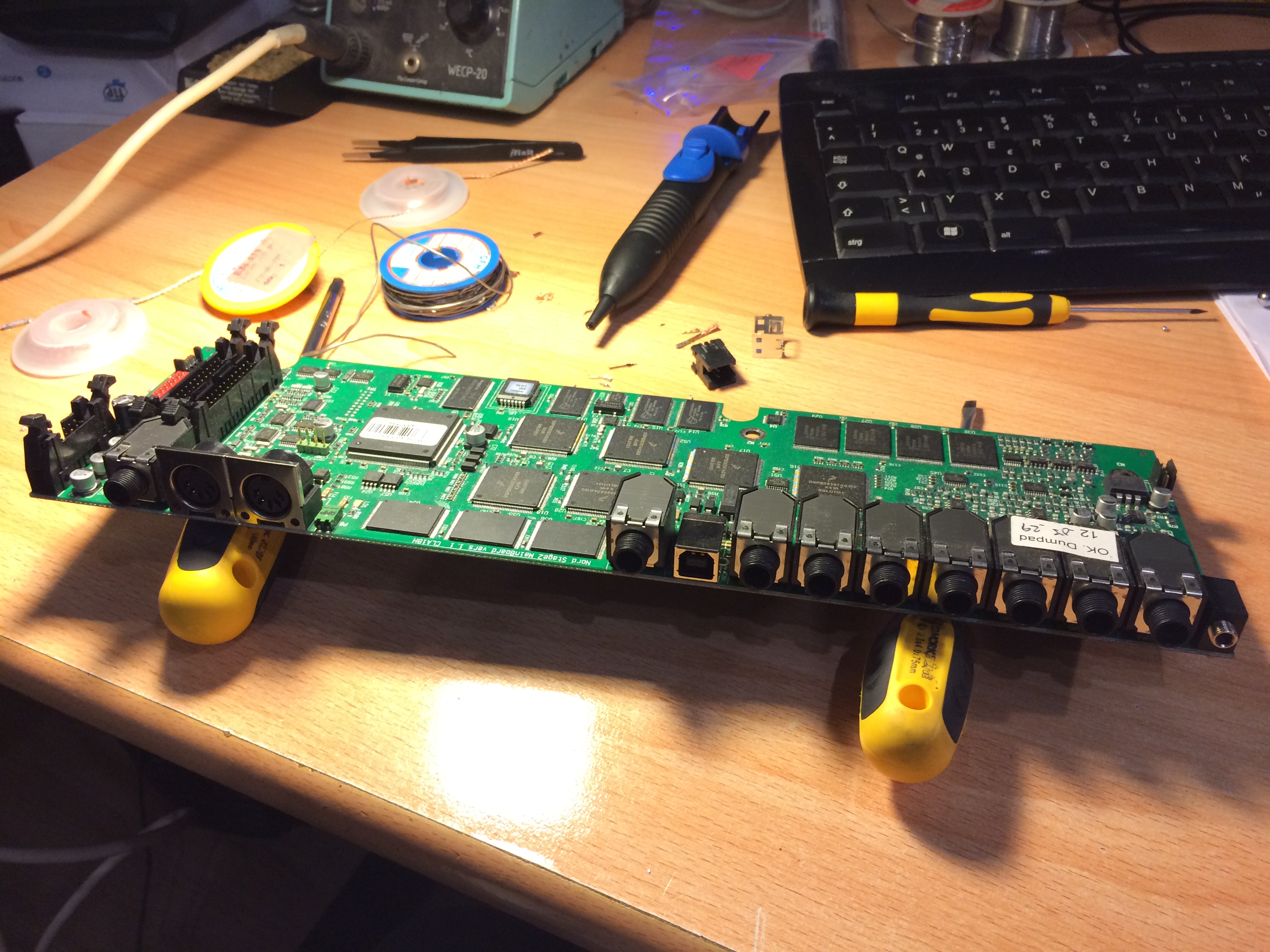 The main board removed from the casing. The USB port has been already replaced.